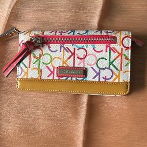 Calvin Klein wrist wallet/purse. Colorful ck logo on front and back.